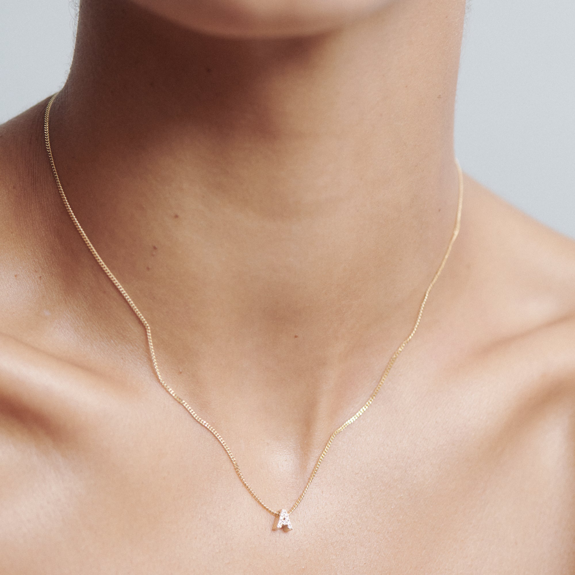 Tiny diamond on sale gold necklace